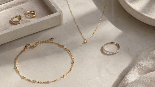 Best minimalist jewelry brands displayed as delicate necklaces, rings, bracelets, and earrings