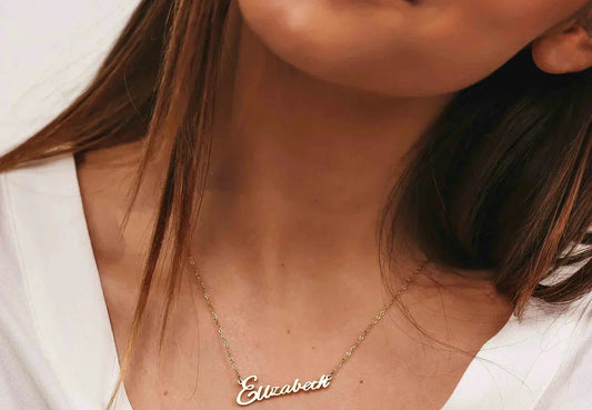 Dainty gold and silver necklaces styled with a square neckline dress