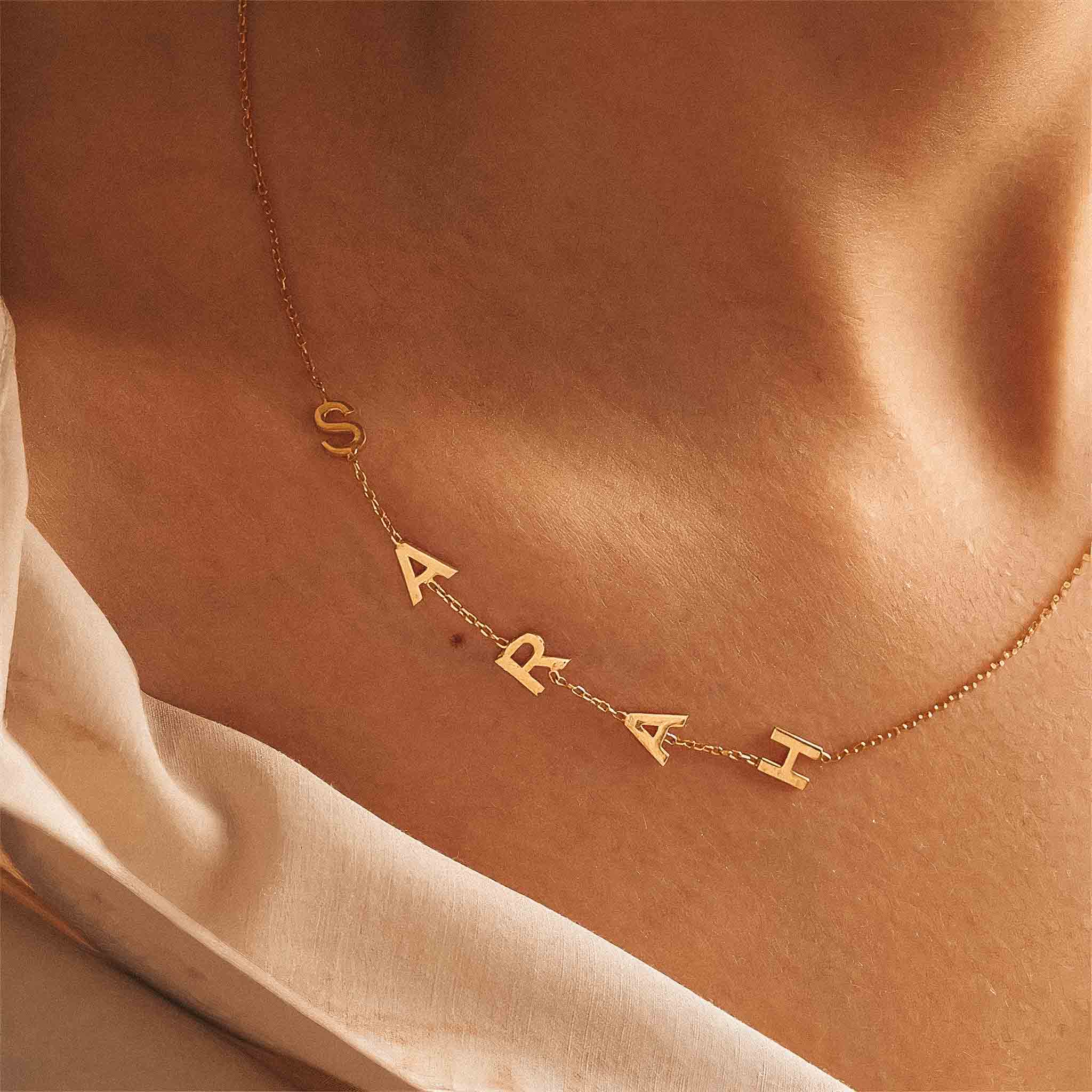 Name necklace spaced on sale out